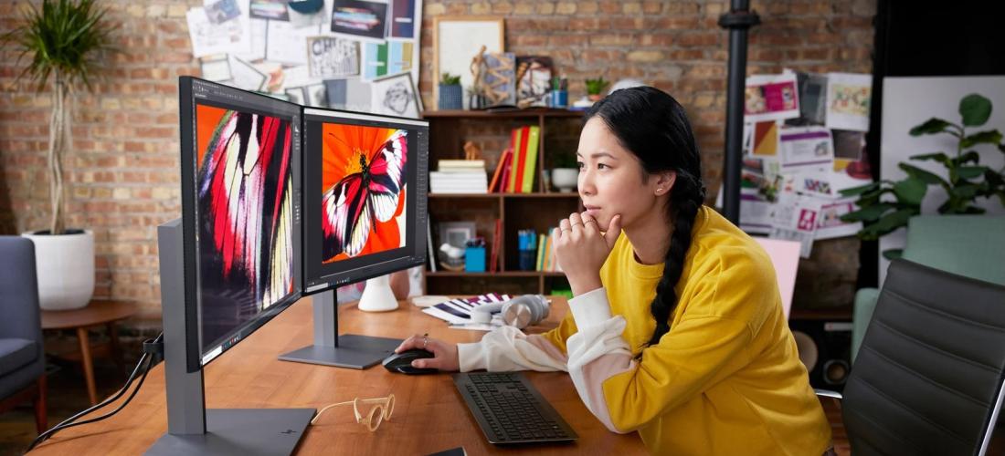 A woman at her desktop computer
